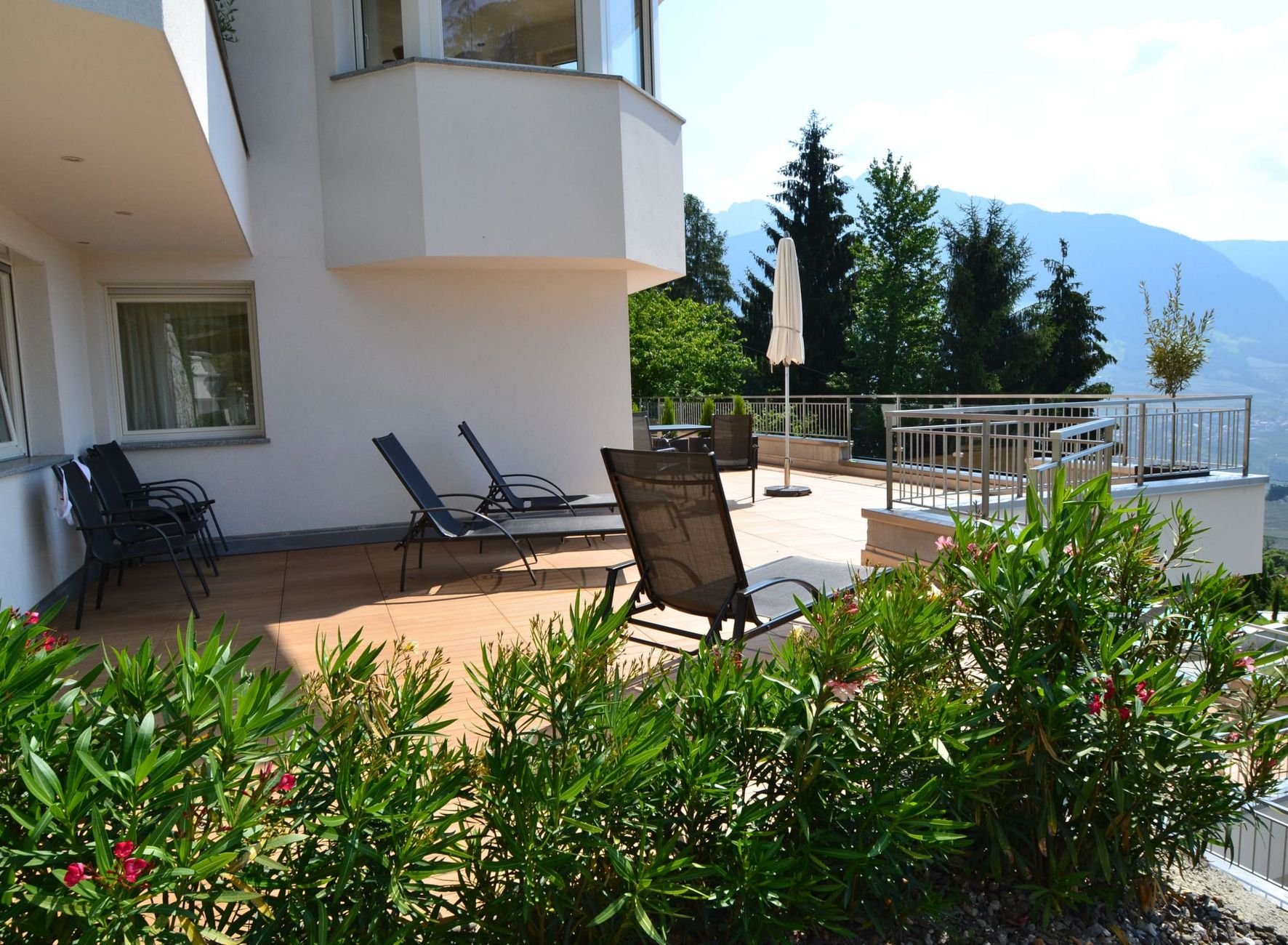 Terrace with sun loungers in the Residence Lechner Vacation Dorf Tirol Residence Lechner terrace sun loungers